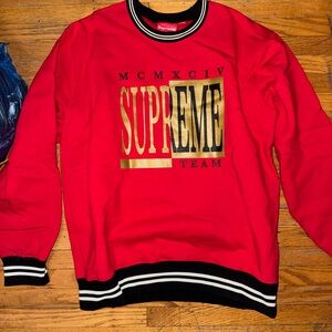 Supreme Red Crewneck Sweatshirt with Gold Logo